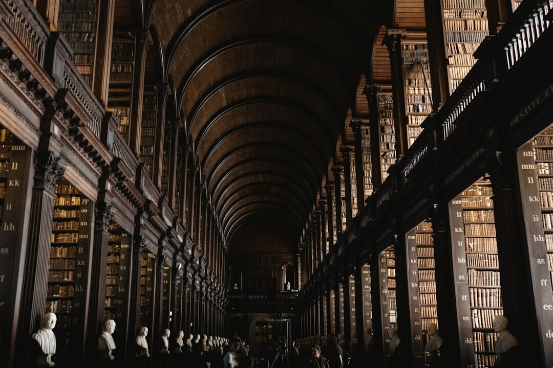 Interior of an old library with tall wooden bookshelves